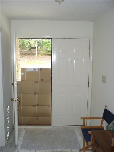 09220001.JPG - 9/22/2006  We heard UPS drive up but neither my wife not I were free at the moment to go to the door.  When we did get to the door we were greeted with a bunch of boxes that prevented us from getting out.